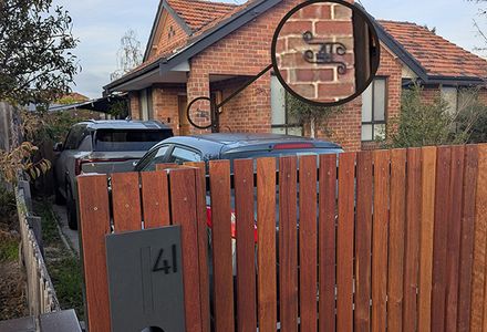 A house displays its address number on the letterbox and the front of the building.